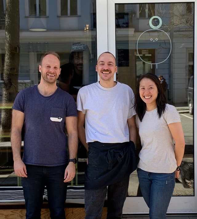 An image of three people in front of a gelato store